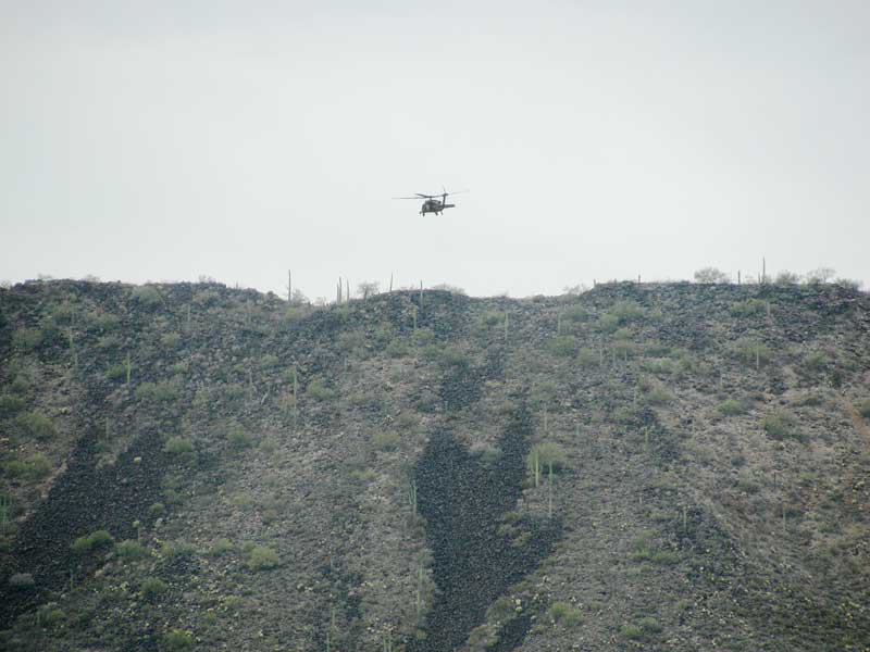 Helicopters can be seen blowing down illegal drug cartel camps hiding in the mountains of Arizona, where they keep an eye out for US Border Patrol.