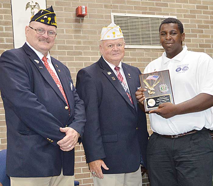 Law Cadet Michael Sulton was presented the Male “Top Trigger” Award by American Legion Dept.  of South Carolina Commander John H. Britt, as American Legion Laurens Post 25 member Russ Cantrell observes.