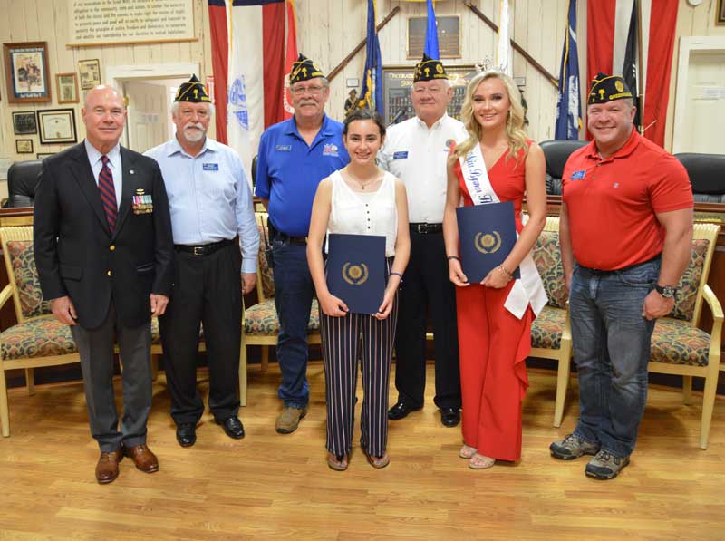 Left to right: Colonel Mike Stahl, USMC (Ret.), American Legion Post 3 Commander Kevin Smith, 1st Vice Commander Duanne Kelly, Emma Devine as Pianist, Adjutant Don Patterson, Soloist Ema Brooke Alley and 2nd Vice Commander Eric Moe.