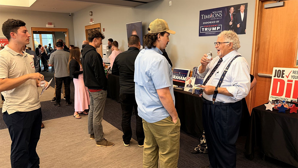 Greenville County Council District 17 candidate Joe Dill meets one-on-one with a voter during the “Get Connected!” multi-candidate Republican event at Hughes Main Library.