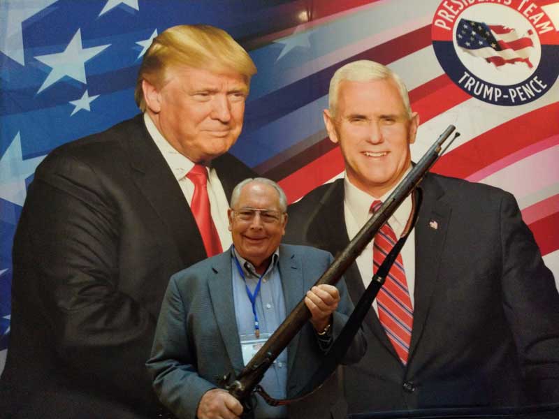 Bill Lamb Posing In From of Trump Pence Banner