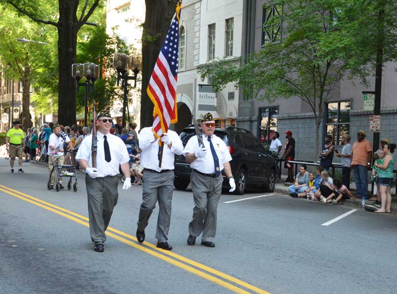 Color Guard Members Dale McCoy, Jamie Richards, Bruce Bartlett of American Legion Major Rudolf Anderson, Jr. Post 214 take part in 2019 Armed Forces Day Parade Downtown Greenville, S.C. Charlie Porter follows in background.