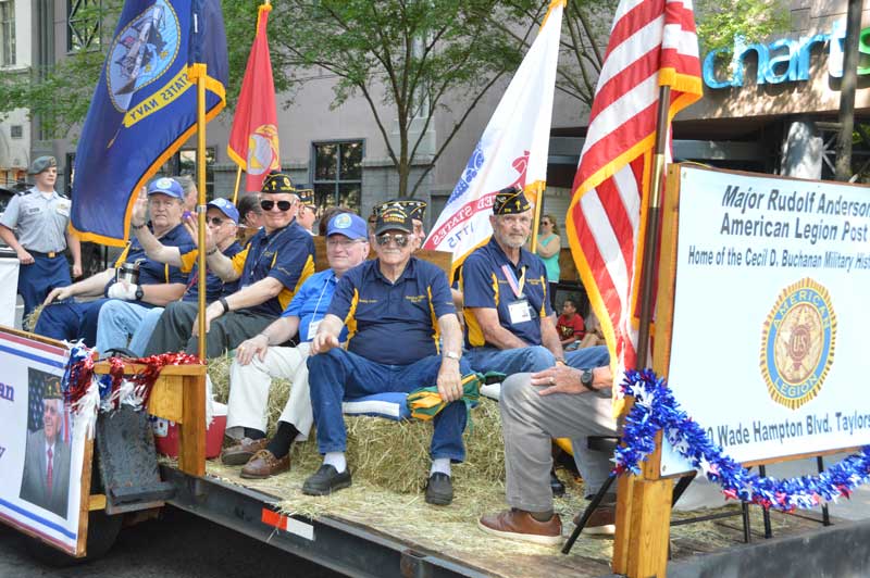 Veterans and members of American Legion Major Rudolf Anderson, Jr. Post 214 enjoy their part  of riding on a float in the 2019 Armed Forces Day Parade Downtown Greenville, S.C.