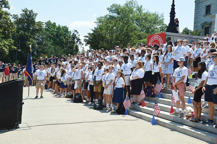 Palmetto Boys and Girls State citizens stand and sing “God Bless America.”
