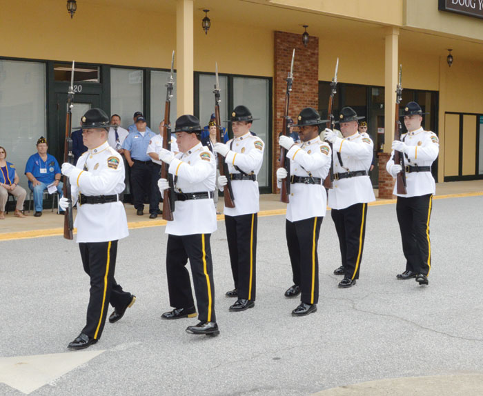 A solemn memorial service is conducted by volunteer members of the Spartanburg County Sheriff Dept. Honor Guard. The service begins with six Honor Guard members carrying M-1 Garand Rifles with fixed bayonets.