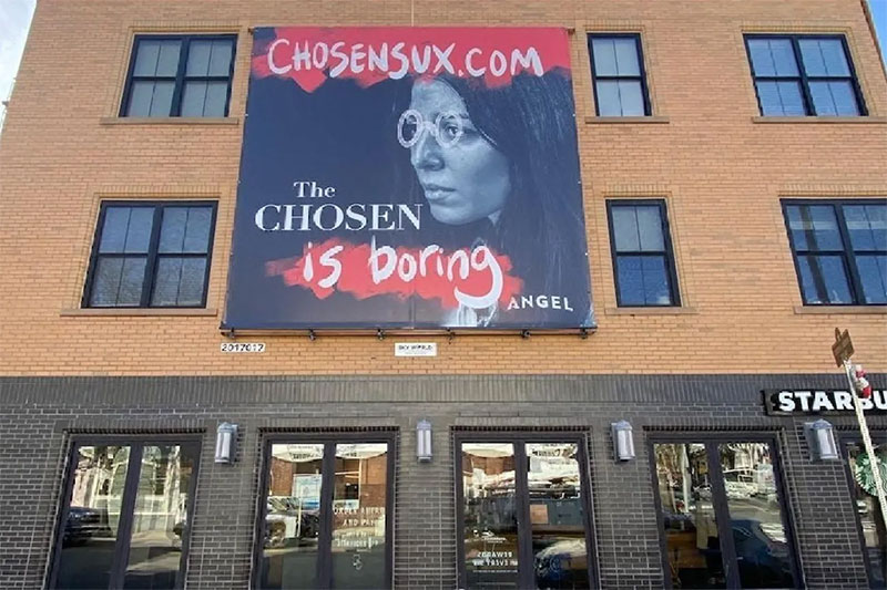 One of 70 “defaced” billboards for “The Chosen” is pictured in Boston. The defaced billboards are part of an ad campaign ruse planned by marketers of the popular faith-based show.