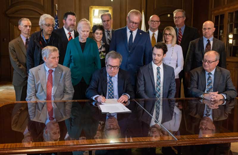 Acting EPA Administrator Andrew Wheeler signs alongside members of the State Review of Oil and Natural Gas Environmental Regulations.