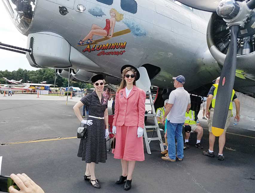 Heather & Raquelle Sheen pose in 1940s garb by the B-17.