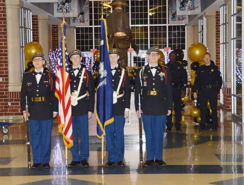 Left to right: Cadet Berg (Rifle), Cadet Johnson (US Flag), Cadet Donlin (SC FLag) and Cadet Berg (Rifle) prepare to Post the Colors.