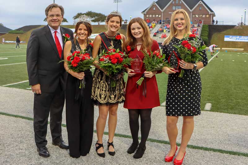 From left: NGU President Dr. Gene C. Fant, Jr.; 2018 Homecoming Queen Allison Yeater; 2019 Homecoming Queen Abbey Blackwood; Abi Waters, second runner-up; and Josey Dorn, first runner-up announced at halftime of the Crusader’s homecoming game against Valdosta State.