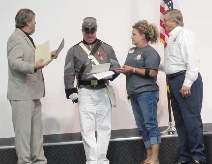 16th Regiment, SC, Volunteers Camp 36 Sons of Confederate Veterans Commander Frank Tucker presents Robert Elrod the War Service Medal and Division Life Member certificate.