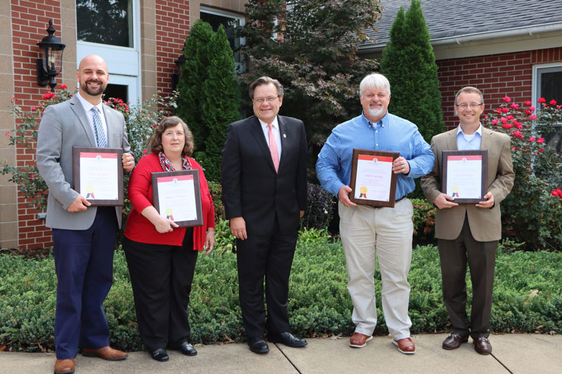 The University honored expiring term Board members. From left: Dr. Travis Agnew from Greenville, Rebecca Coleman from Dillon, NGU President Dr. Gene C. Fant Jr., Rev. Seth Buckley from Moore, and Claude Tackett from Hanahan. Not pictured is James M. Cudd from Gaffney.