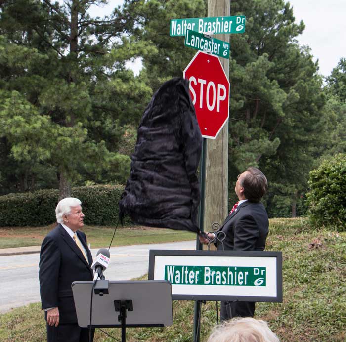 L to R: Walt Brashier and NGU President Dr. Gene C. Fant, Jr. unveiling the new street sign at a ceremonial unveiling on Friday at the Tim Brashier Campus at Greer.  The street sign leading to the campus from Poinsett Street is now named Walter Brashier Drive in honor of the graduate school’s namesake. The Tim Brashier Campus is named in memory of the Brashier’s son, Tim Brashier, a 1976 NGU alumnus. New expanded scholarship opportunities were also announced and are available through the Tim Brashier Scholars program. 