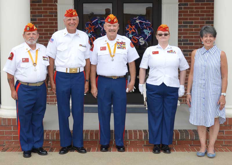 Wade Rhoney, Tom Fowler, Jim Stone, Deborah Stone, Joey Fowler from Marine Corps League Color Guard, Det. no 5, preparing to show Wrenn Memorial Baptist congregation when folding the US Flag what each fold means.