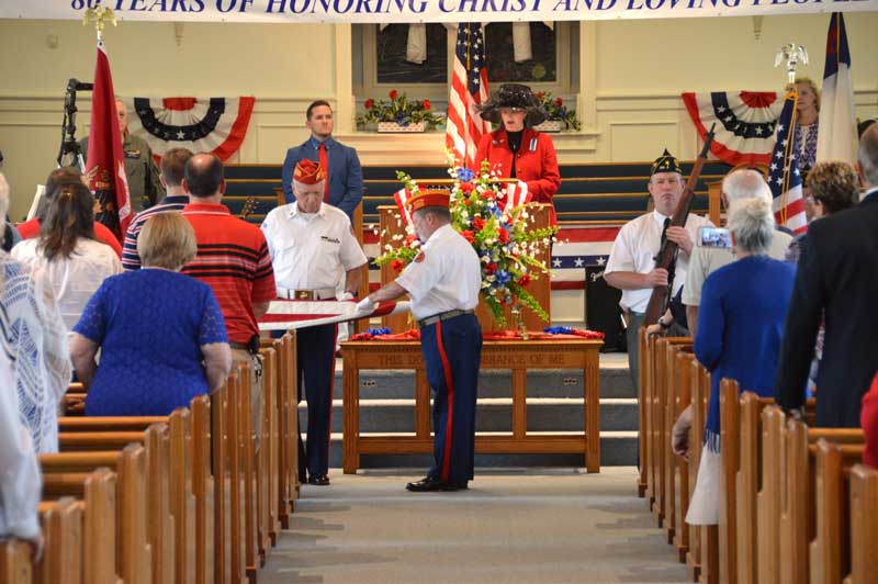 Wrenn Memorial Baptist Church congregation experienced US Flag folding ceremony. Shown here are Tom Flower, Wade Rhoney folding flag. Pam Durham explaining what each fold means. Dale McCoy with rafle.
