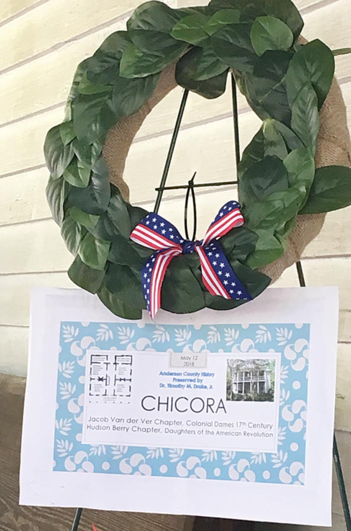 Magnolia Wreath – Dr. Barnes made a traditional colonial magnolia wreath as well as a display on the architecture of the house for the front porch display area.