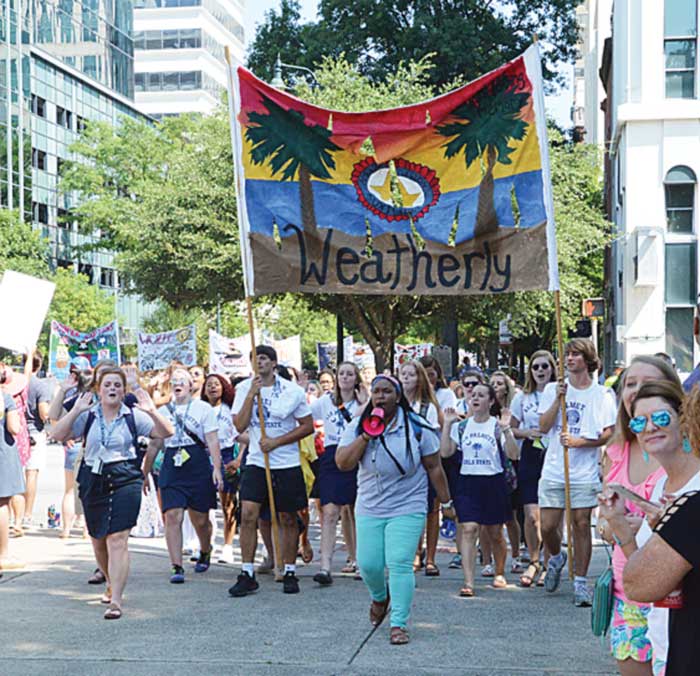Palmetto Boys State citizens help carry the Palmetto Girls State banner in the parade this past Friday. Palmetto Boys State citizens help carry the Palmetto Girls State banner in the parade this past Friday.